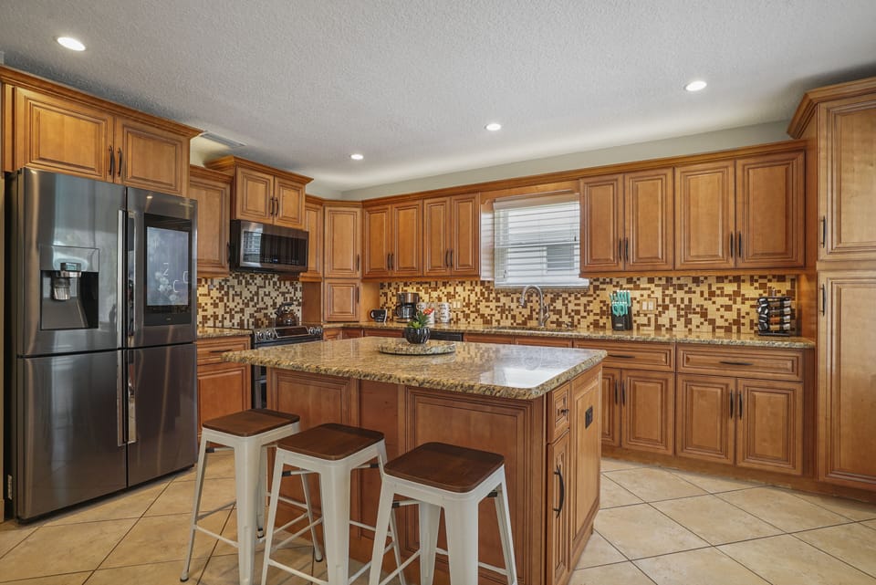 Fully Equipped Gourmet Kitchen with Ultra-Modern Stainless Steel Appliances 