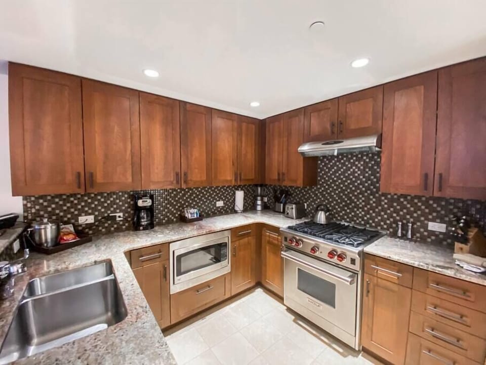 Spacious Kitchen equipped with Wolf Kitchen Range and Sub Zero Refrigerator