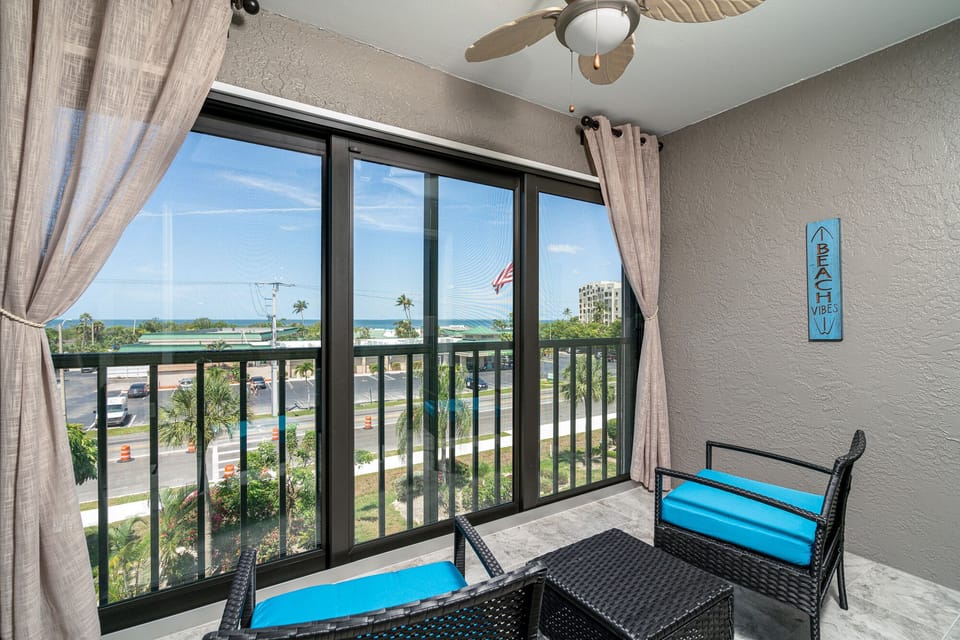 Past the living room is the most unique enclosed lanai where you can sit and enjoy your beautiful gulf view