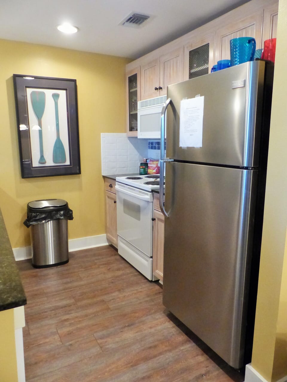 Kitchen with full size refrigerator, stove, microwave and dishwasher