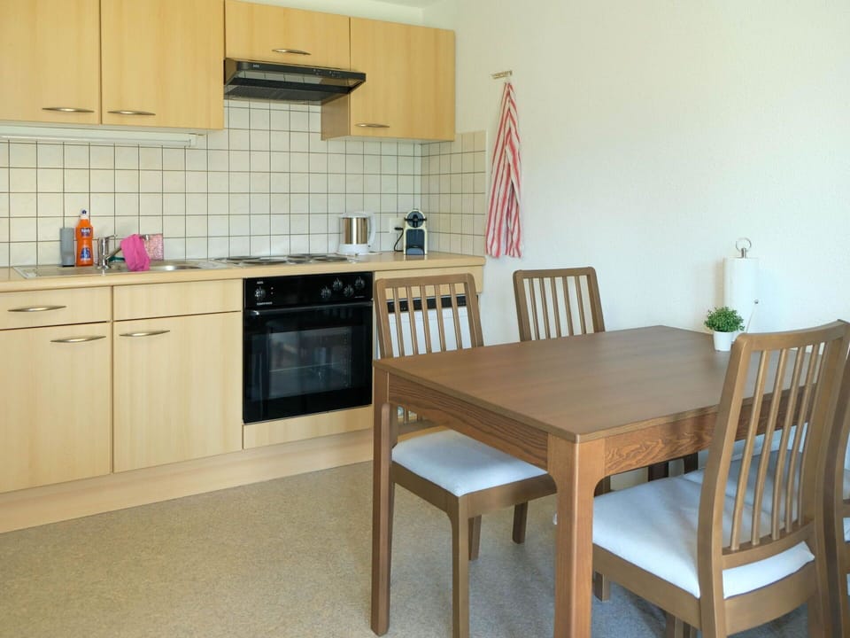 Furniture, Flooring, Floor, Interior Design, Wood, Cabinetry, Room, Kitchen & Dining Room Table, Chair, Lighting