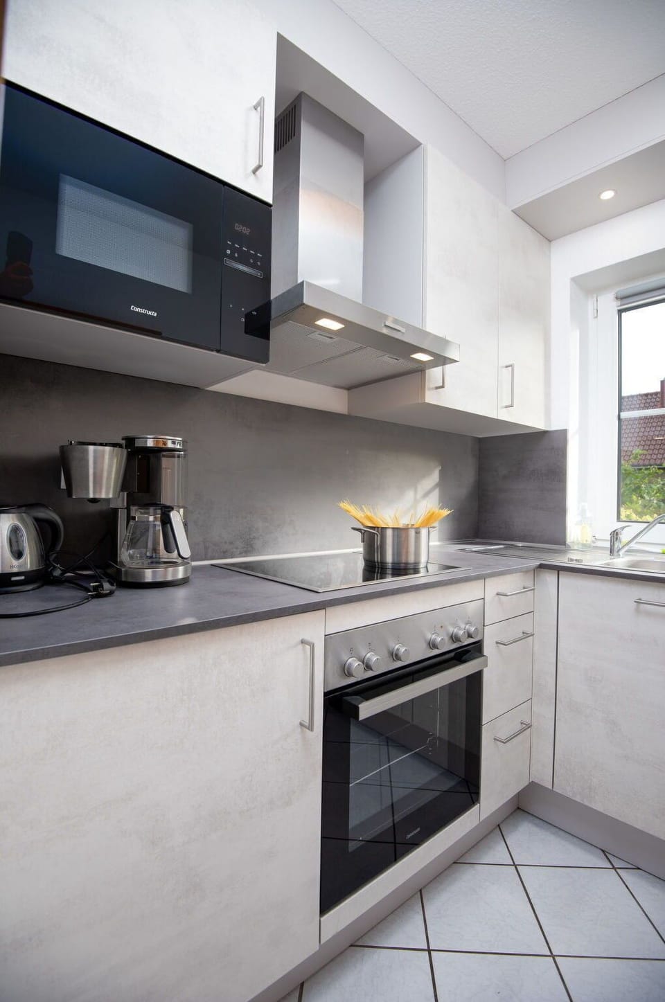 Cabinetry, Countertop, Building, Kitchen Stove, Kitchen Appliance, Kitchen, Window, Cooktop, Stove, Home Appliance