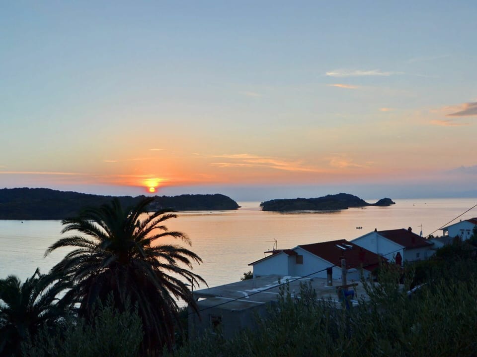 Water, Cloud, Sky, Plant, Afterglow, Azure, Dusk, Orange, Building, Coastal And Oceanic Landforms