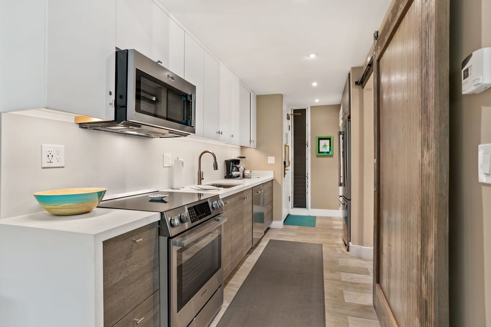 Your fully-equipped kitchen features stainless steel appliances, plenty of counter space, and everything you need to whip up a delicious home-cooked meal during your stay.