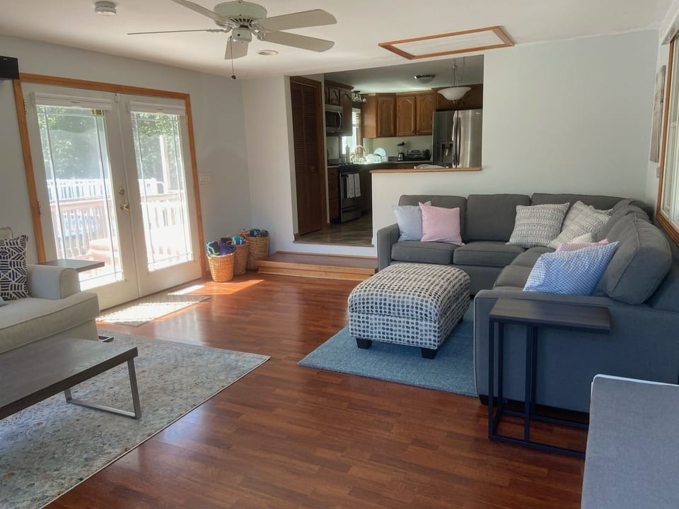 Fantastic front living room with glass doors to the backyard.