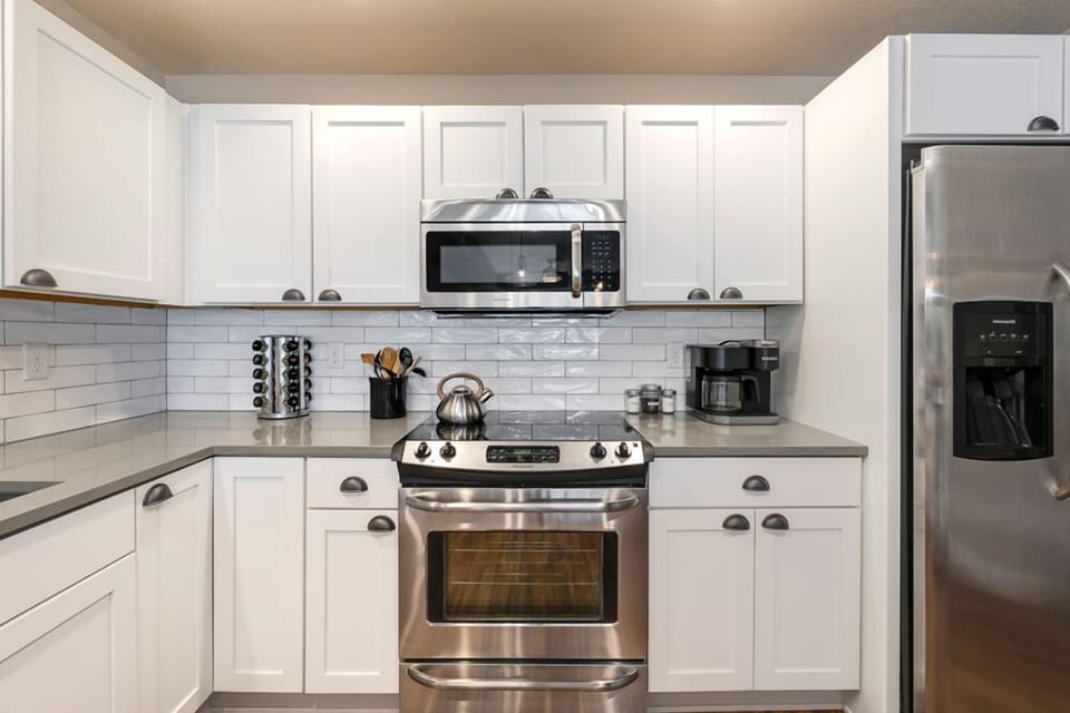 Bright Kitchen with Stainless Steel Appliances