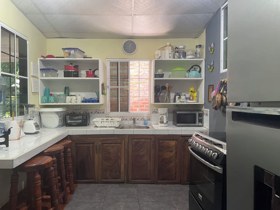 Kitchen with
Pots and pans, utensils
blender, microwave toaster oven