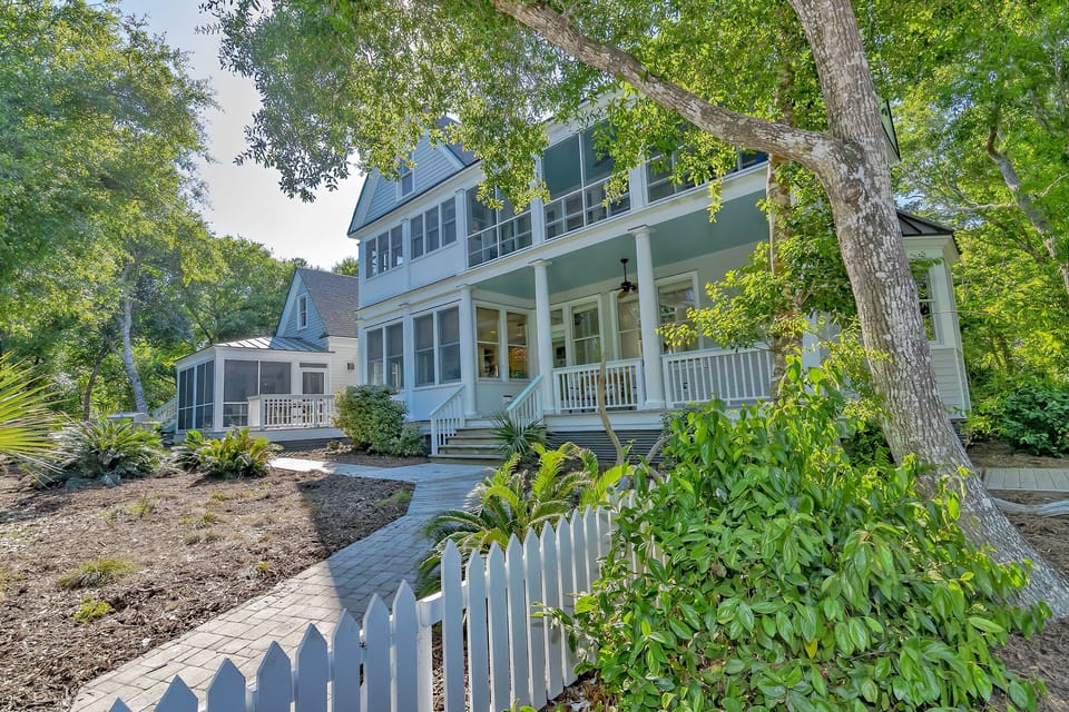South side of house with MBR wing & screen porch in background. 