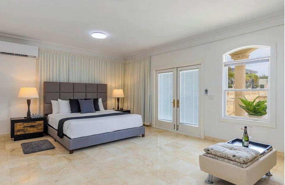 Large Master Bedroom with pool views/access.