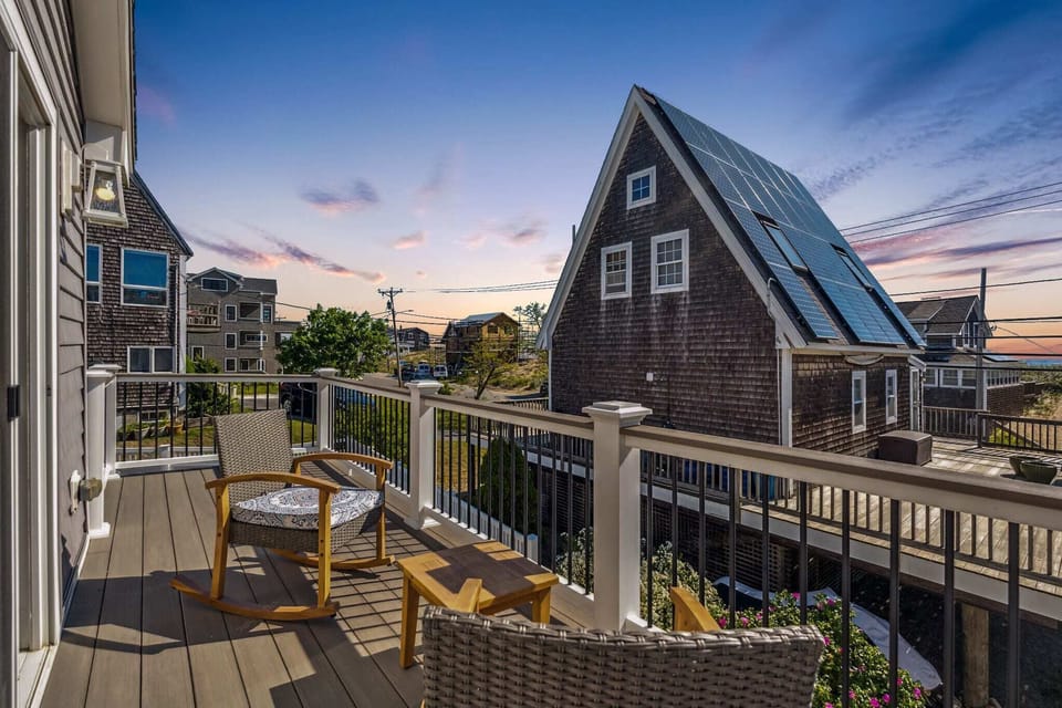 Balcony right off the primary bedroom with outdoor seating and to enjoy the ocean views