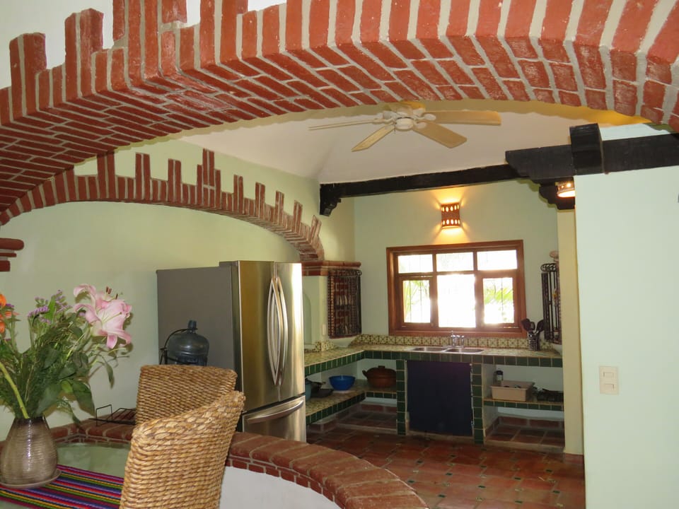 Kitchen has full fridge & freezer, gas stove, pantry, all needed pots and dishes