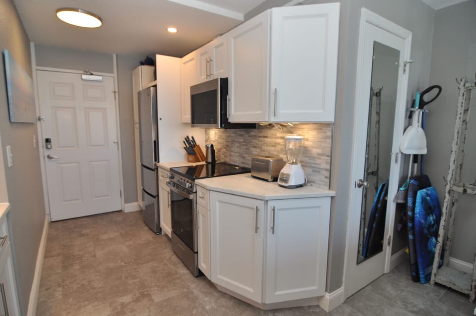 Next to fridge we have small closet to hang your clothes or stock with groceries