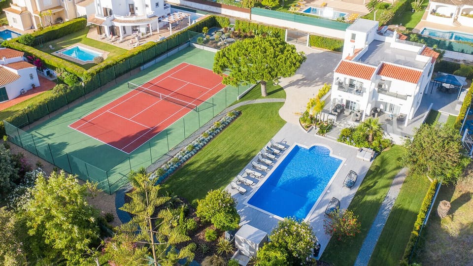 Private tennis court and swimming pool