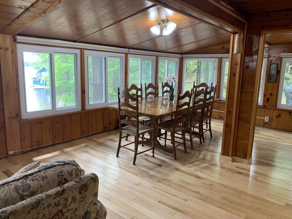 from den looking out to the sitting area and dining room
