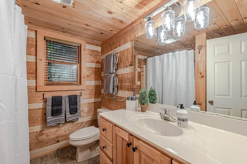 Bathroom on main floor. Tub and Shower combo with towel warming racks.