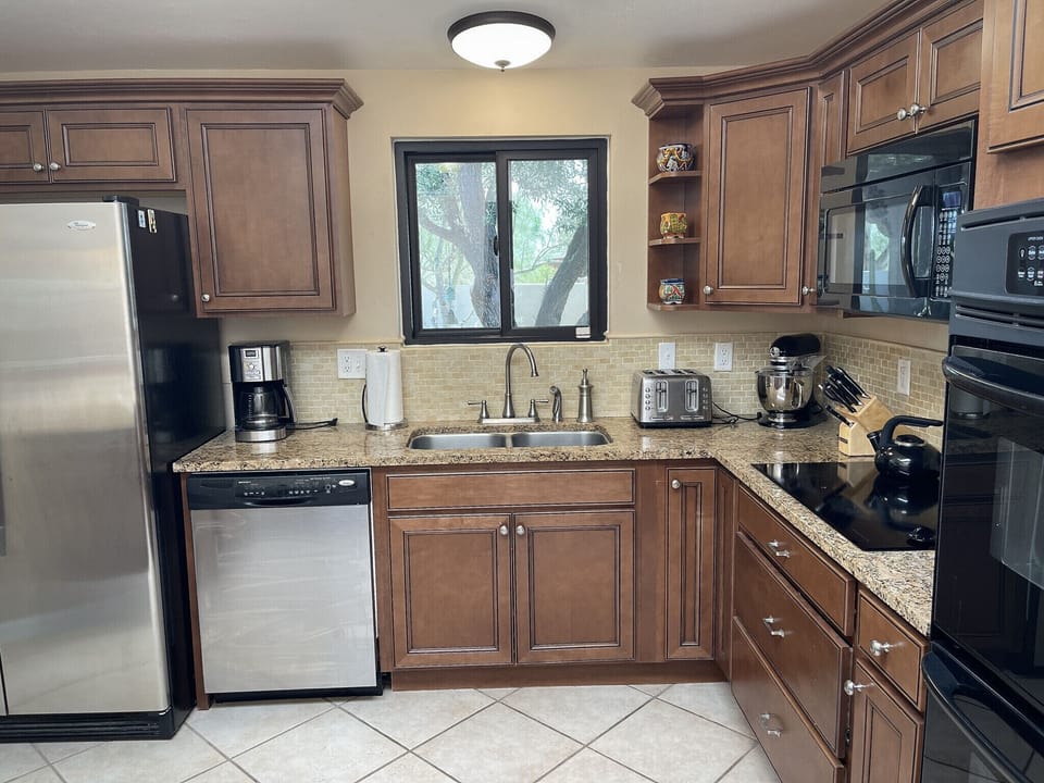 Full kitchen with updated appliances and granite counter