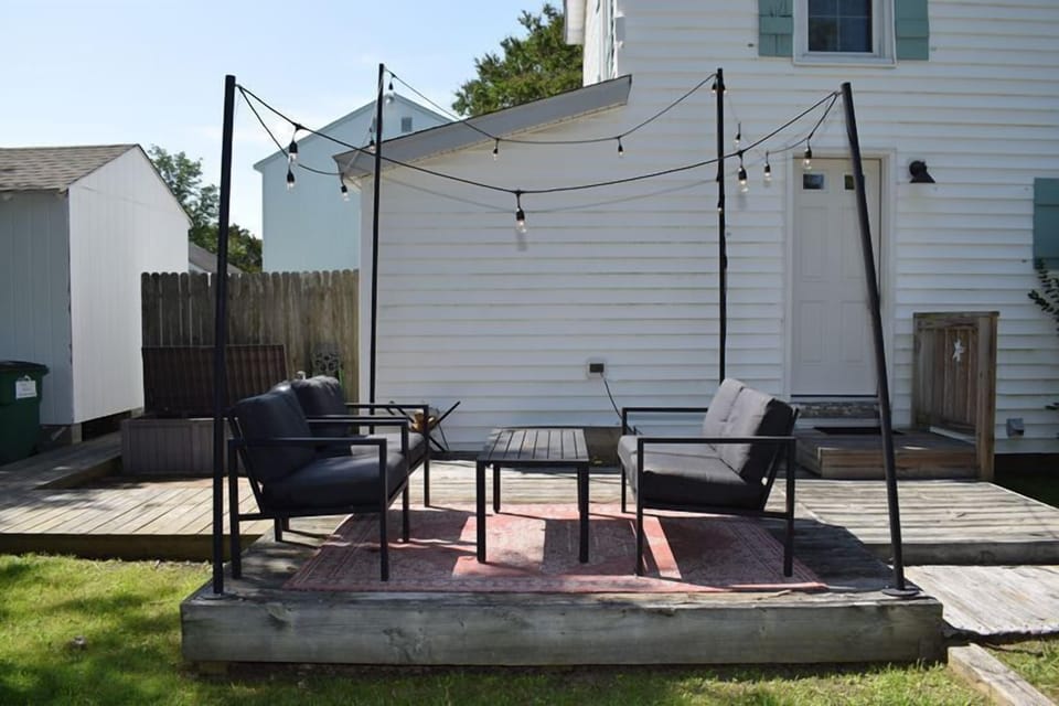 The deck offers a great space to gather and even has a path to the enclosed outdoor shower.