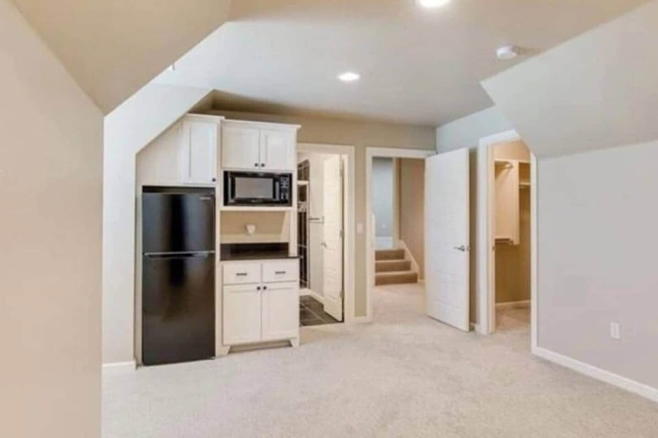 Upstairs queen bedroom with fridge/microwave