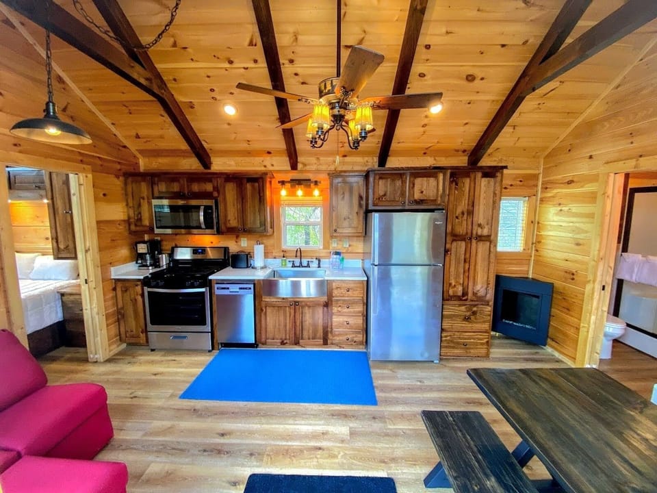 The gas fireplace beside the full kitchen enhances the coziness.