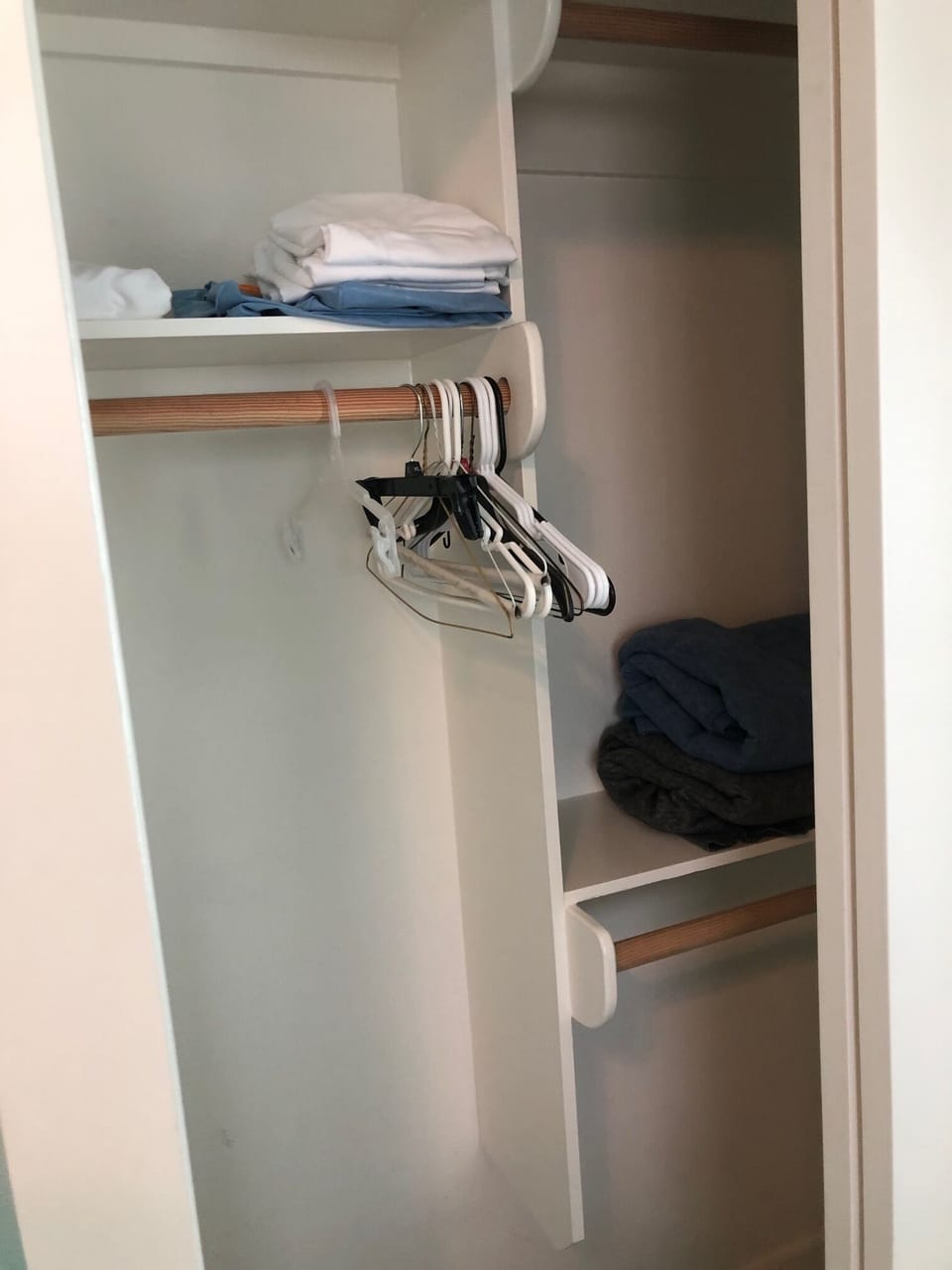 Hangers, extra pillows and blankets in closet