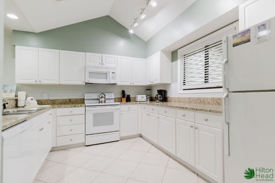 Cook family favorites in the fully equipped, gleaming white kitchen.