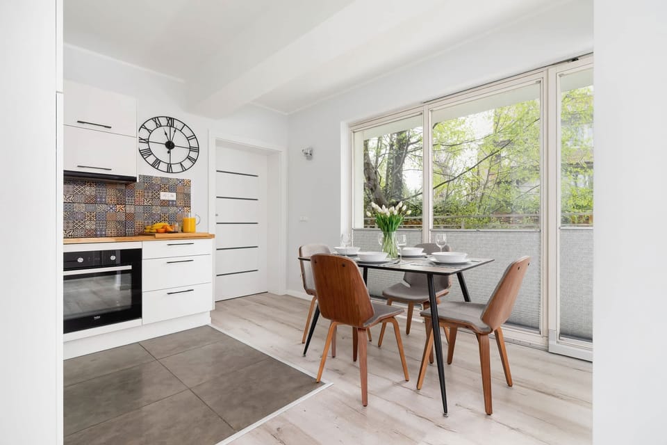 The sleek design of the kitchenette blending seamlessly with the living area.