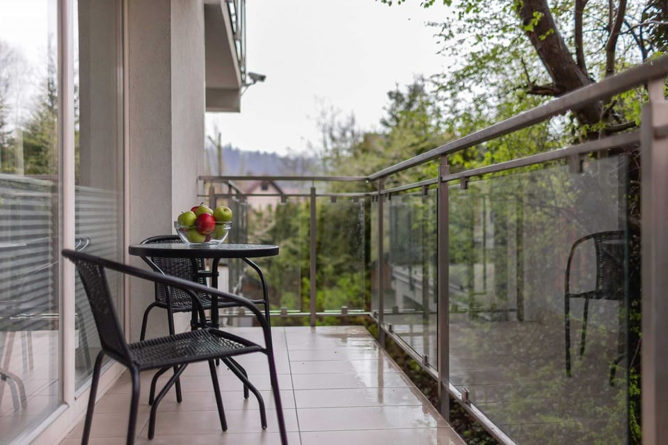 Relax on the balcony's comfortable chairs and enjoy the fresh air.