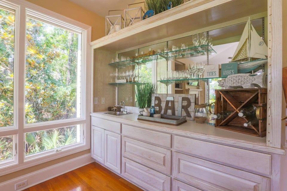This wet bar is located in the living room near the stairwell to the master suite.