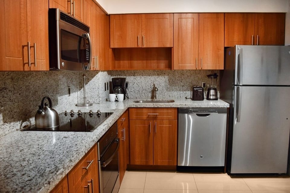 Brew morning coffee easily in this bright, functional kitchen.