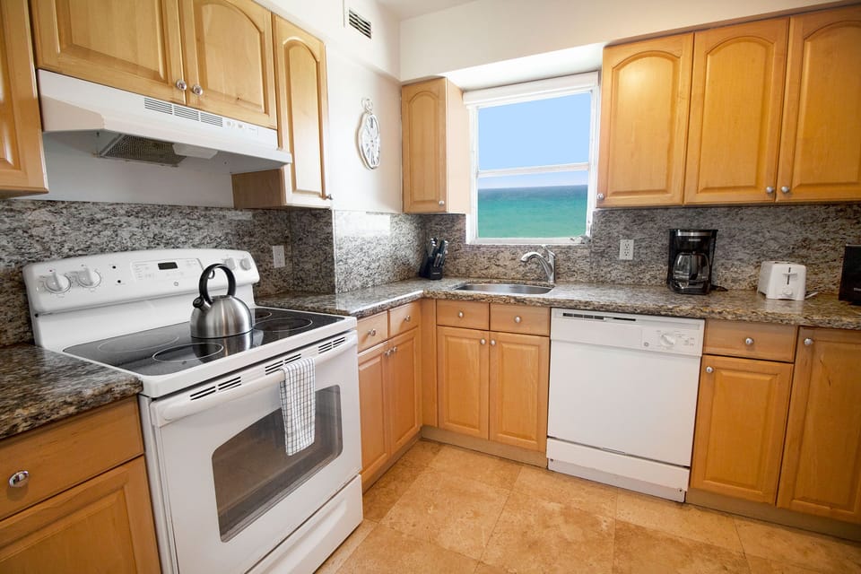 Brew morning coffee while ocean-blue views brighten the sink.