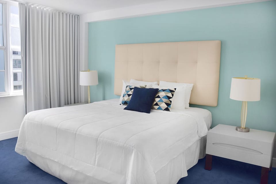Stretch out in a plush king bed under soft, soothing light.