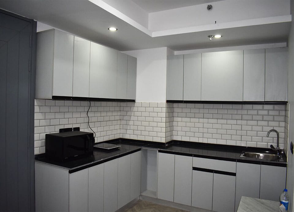 Kitchen of Serviced Apartment by BedChambers in Gurgaon.