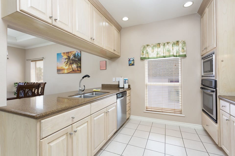The fully equipped kitchen has everything needed to prepare meals throughout your stay.