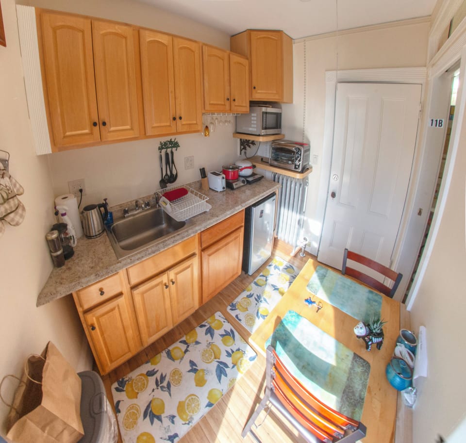 Kitchen, looking towards door of suite.