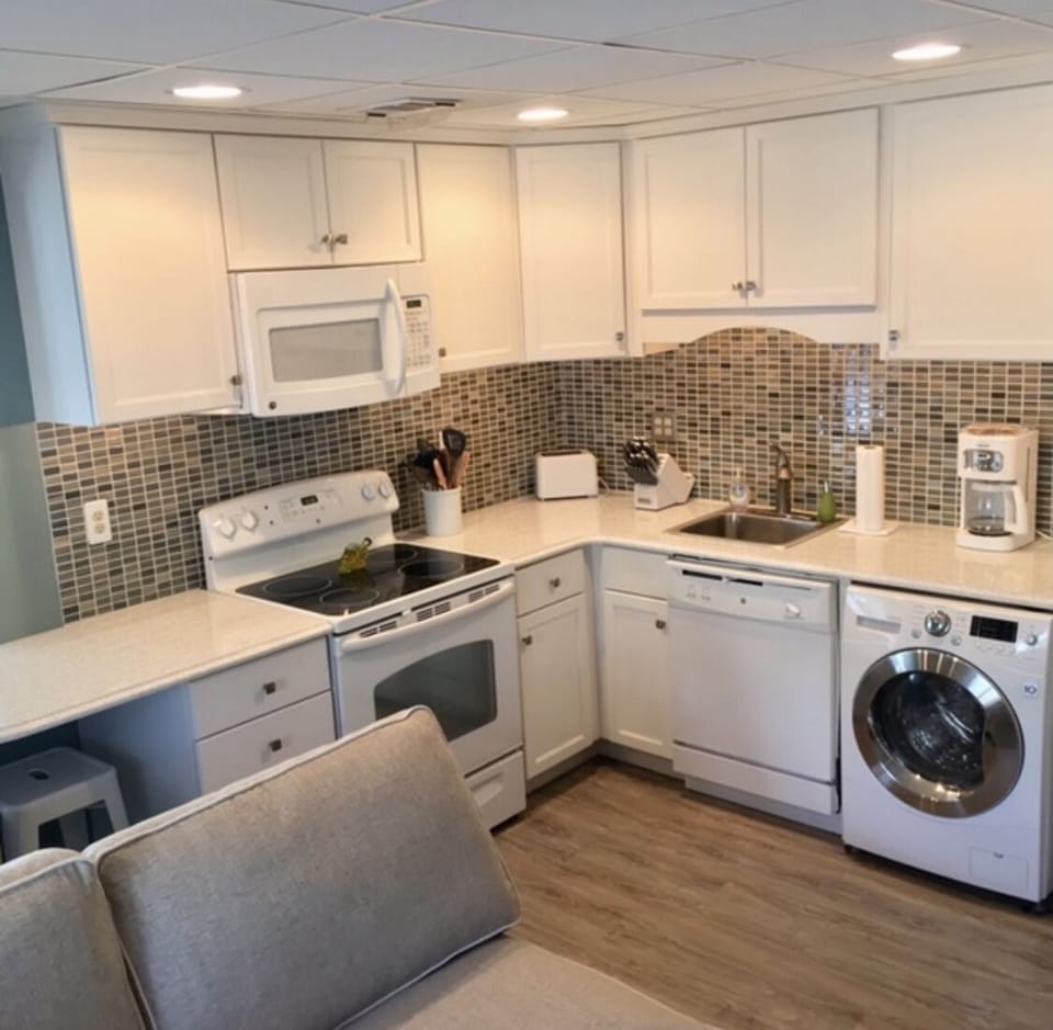 Kitchen - dishwasher, all-in-one washer/dryer, stove, oven, microwave, fridge 