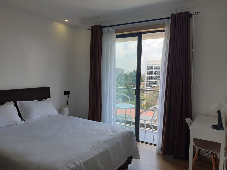Master bedroom opening up to a balcony. The queen bed measures 60"X80"/152×203cm
