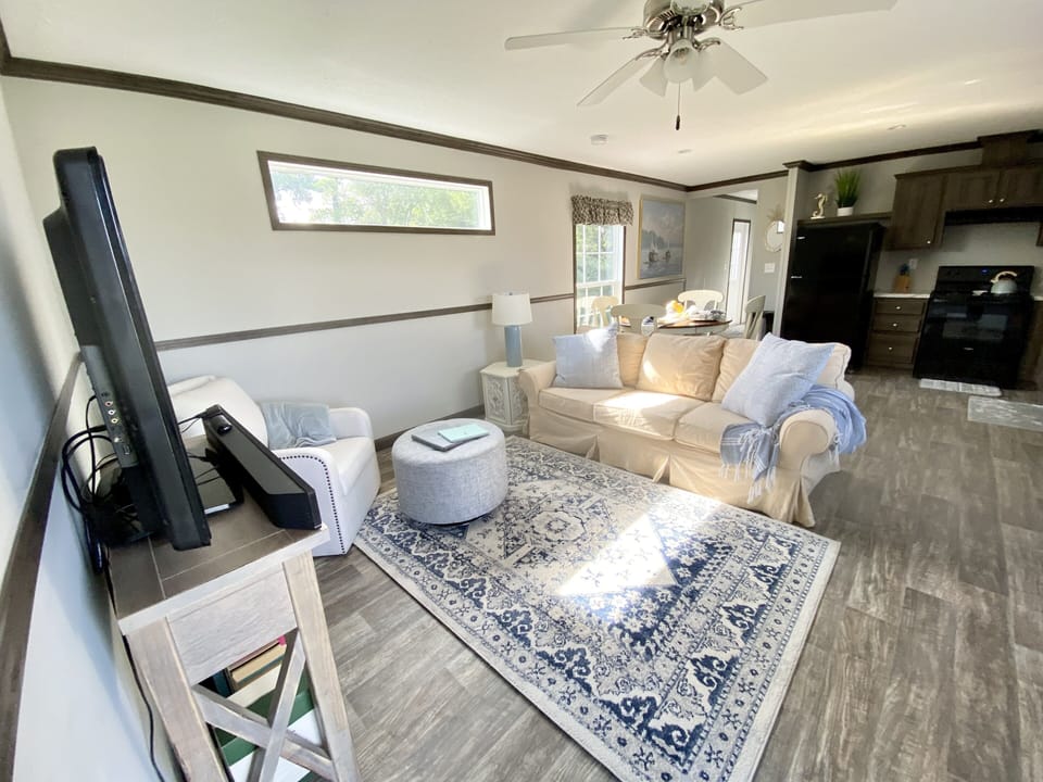 Open concept Living Room, with Smart TV, Board Games, and Books + eat-in kitchen