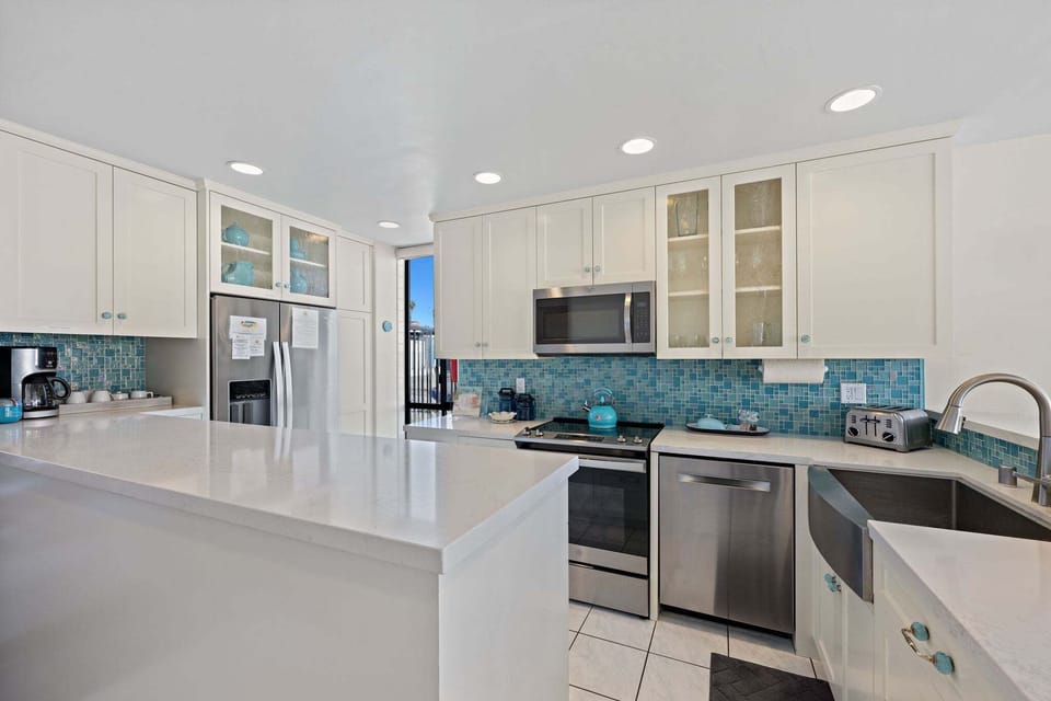 Ocean blue back splash that complements the view of the ocean
