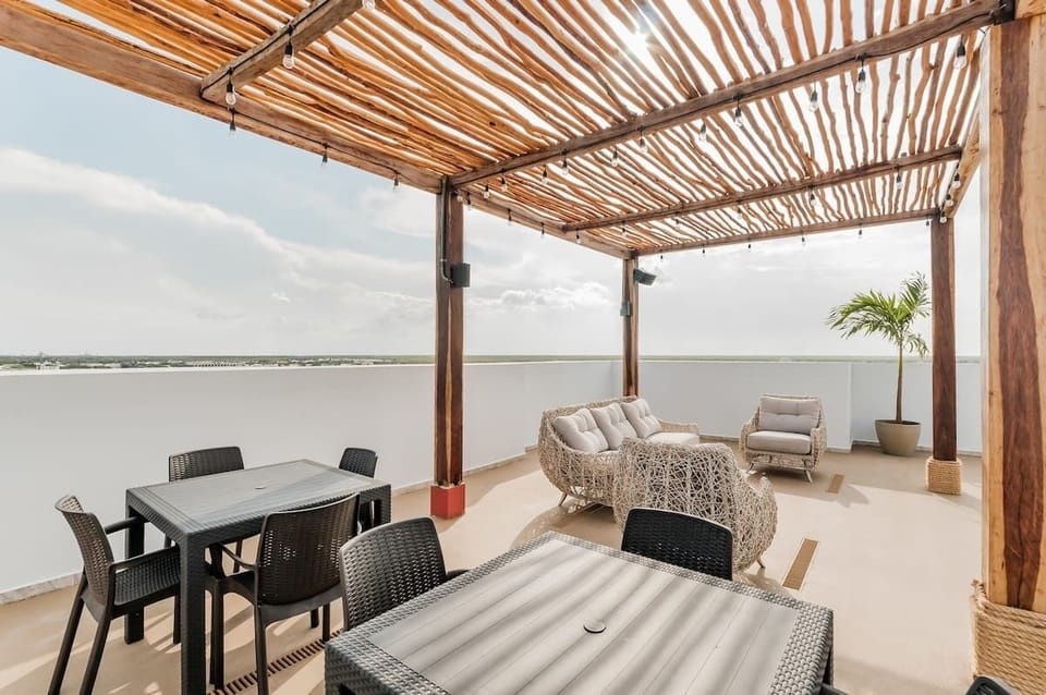 Tables and relaxing area under palapa