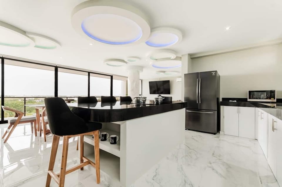 full kitchen with huge breakfast bar for 8 people