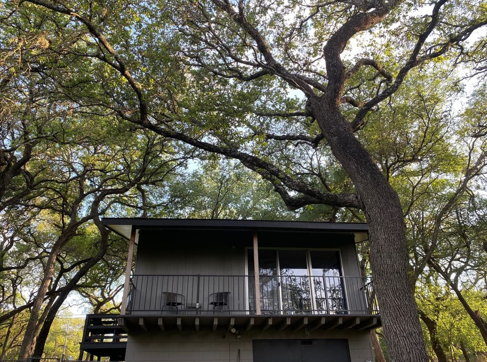 Relax on your treehouse-like back balcony.