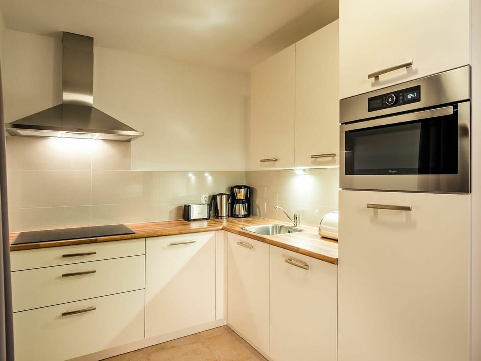 Cabinetry, Countertop, Property, Building, Kitchen, Kitchen Appliance, Kitchen Stove, Drawer, Wood, Home Appliance