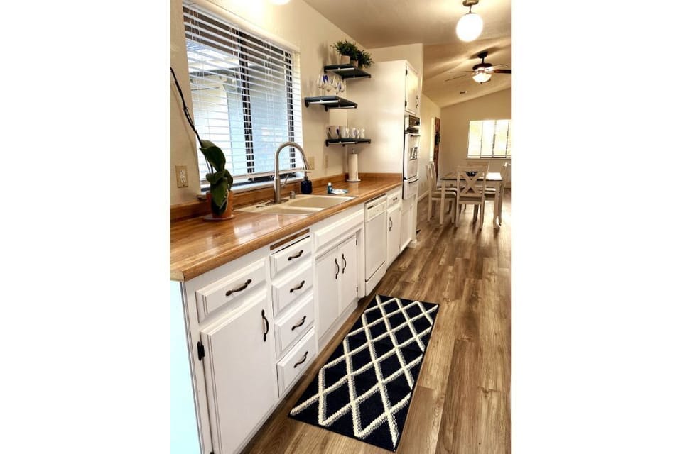 Galley style kitchen with updated appliances