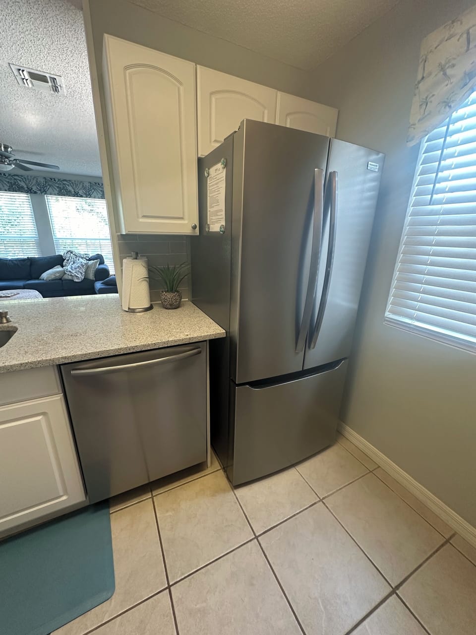 Refrigerator with filtered water inside and ice maker in freezer