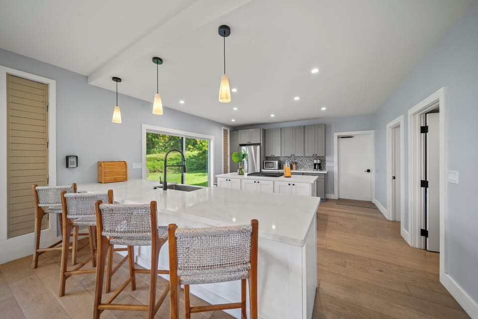 Start your day at the kitchen island with bar seating, perfect for coffee or casual meals.