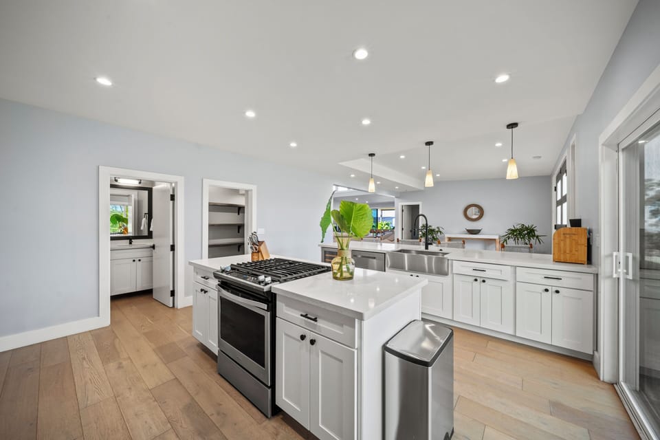 Cook and connect in the gourmet kitchen with a large island, gas range, and space for everyone to gather.