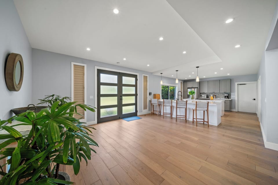 A bright, open layout where wide glass doors lead you straight to the outdoor spaces.