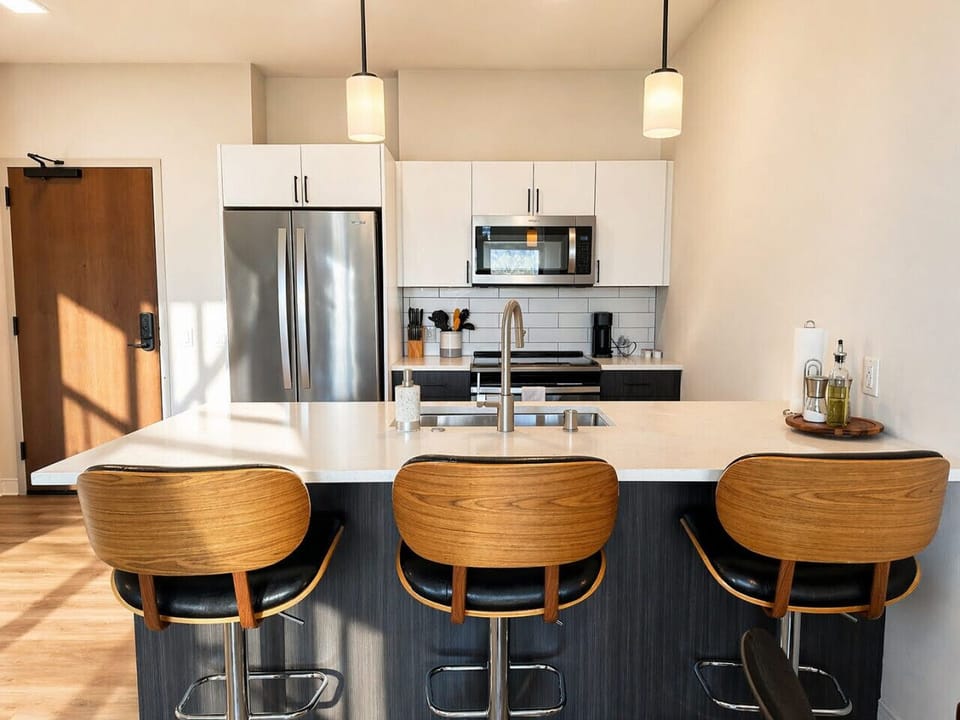 Whip up your favorite meals in this fully equipped, open-concept kitchen that flows seamlessly into the living area—perfect for socializing while you cook