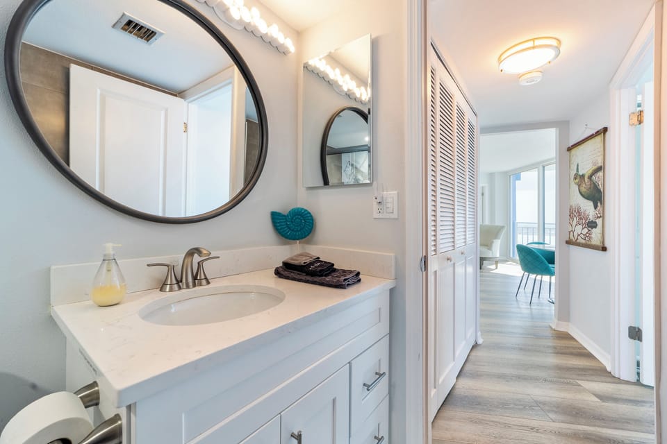 Bathroom is next to the laundry area