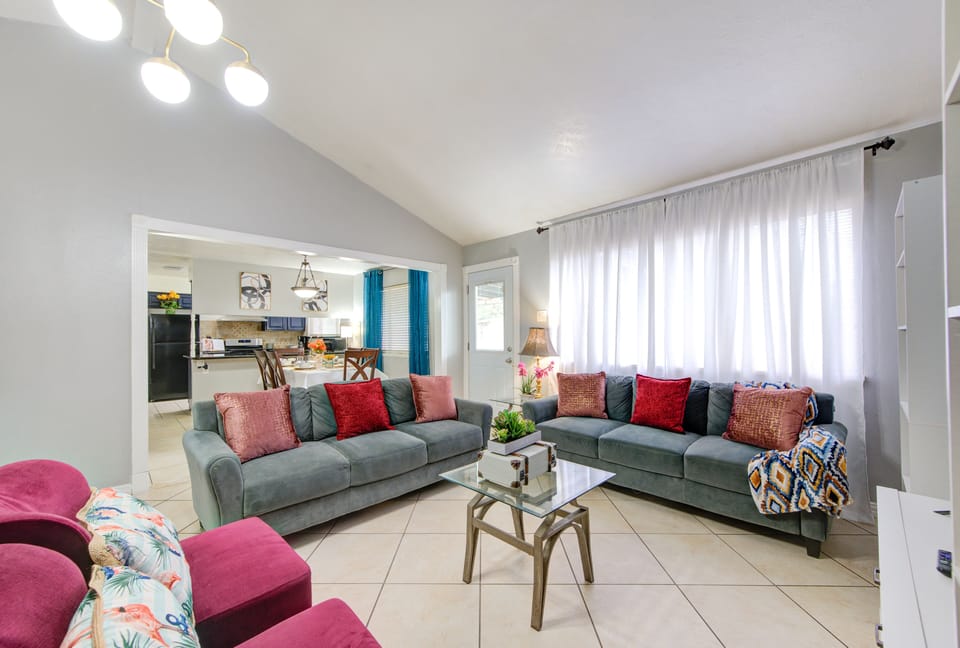 living room with a view of the dinning and kitchen areas